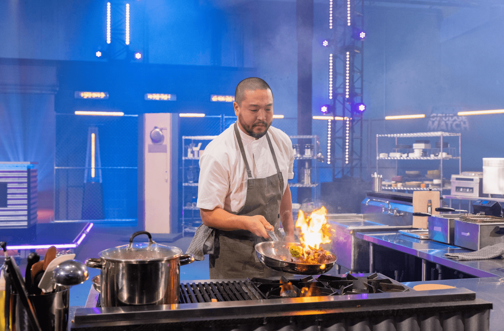 Chef Kevin Lee cooking on the Food Network set